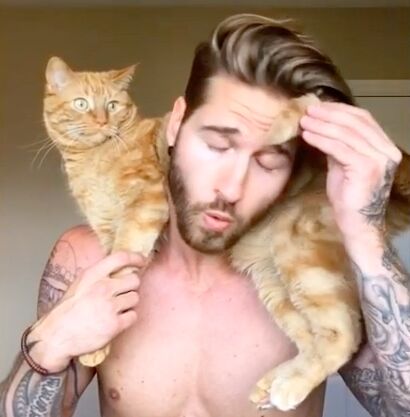 meow hot model loves his adorable cat